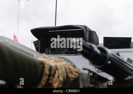 Drivers prism and heavy machine gun on a Fox FV721 armored reconnaissance vehicle Stock Photo