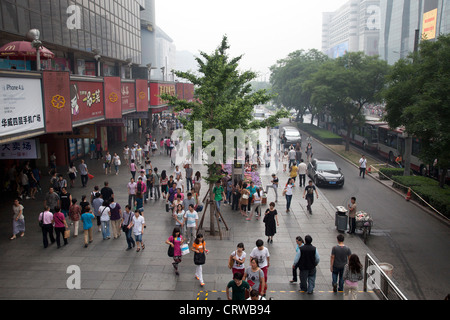 Shoppers outside Joy City shopping mall in Xidan district, one of the main commercial areas in Beijing. Stock Photo