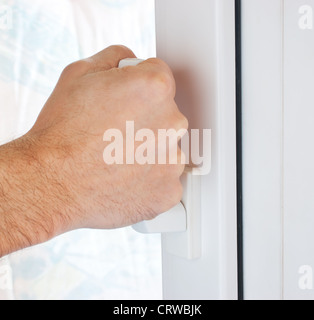 hand opens a window Stock Photo