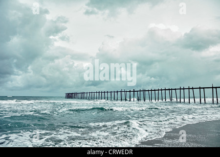 The wooden old jetty over the stormy sea Stock Photo