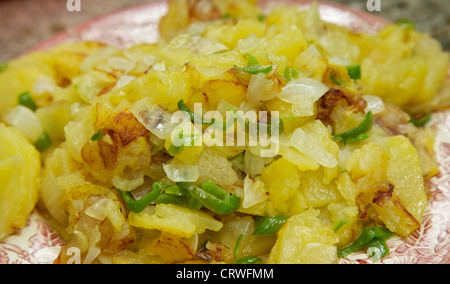 Tortilla de patata with onion and green peppers Stock Photo