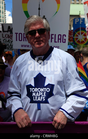 Brian Burke, Toronto Maple Leafs General Manager pictured at the 2012 Pride Parade with Rick Mercer. July 1 2012, Toronto Canada Stock Photo