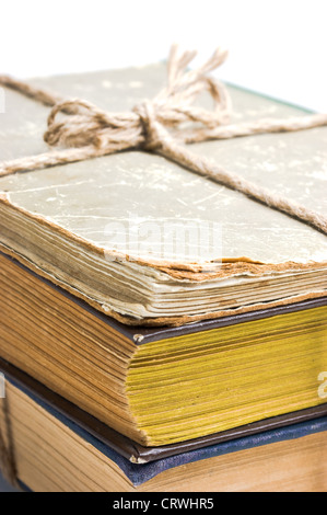 stack of old books tied with rope Stock Photo