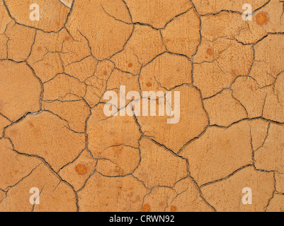 Cracked clay surface Stock Photo