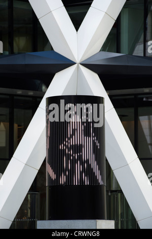 LED pedestrian sculpture outside 30 St Mary Axe / The Gherkin. East End. London Stock Photo