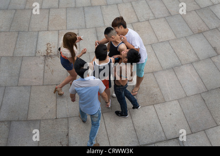 Chinese youths on the Bund, in Shanghai, China. Stock Photo