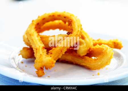 Churros gastronomic scene highlighting breakfast appetizing color and texture Stock Photo
