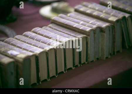 Old books pile from Italian flea market. Toned image Stock Photo