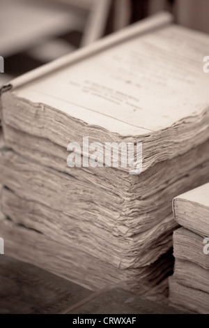 Old books pile from Italian flea market. Toned image Stock Photo