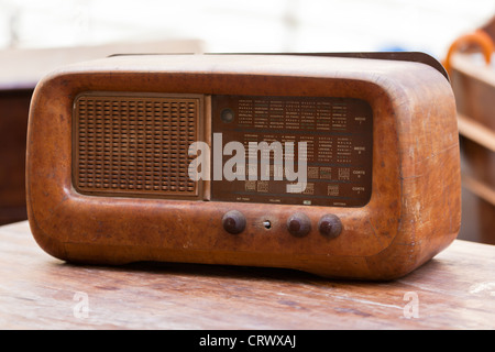 Old broken retro wooden radio from Italian flea market Stock Photo
