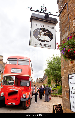 Red double-decker bus, Old White Hart pub, Welland Valley Beer Festival, England Stock Photo