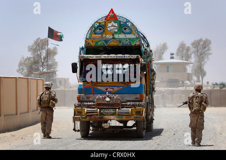 US Marines with Kilo Company stop an Afghan truck at a checkpoint during patrol June 24, 2012 in Garmsir District, Helmand province, Afghanistan. Stock Photo