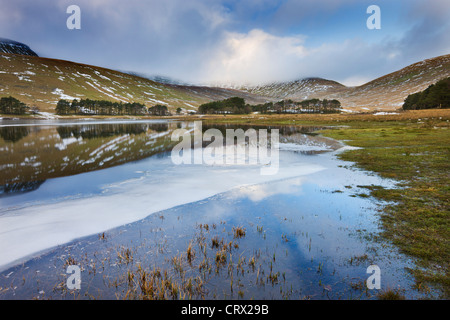 Ice and reflections of Pen y Fan in the Upper Neuadd Reservoir, Brecon Beacons National Park, Powys, Wales Stock Photo