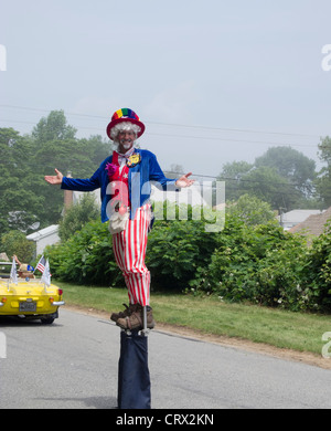 Niantic, CT - 4 July 2011: Small town America annual Independence Day Parade man dressed as Uncle Sam on stilts. Similar photos Stock Photo