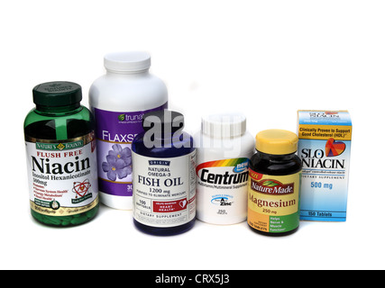 A group of vitamins and supplements. Includes Niacin, fish oil, magnesium, a multi vitamin and flaxseed oil Stock Photo