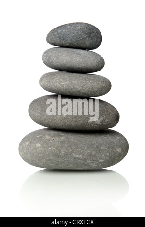 Black stones stacked together isolated over white background Stock Photo