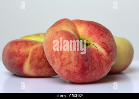 Three flat peaches Stock Photo