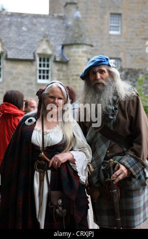 Couple dressed in tradition Scottish Jacobite clothing outside Cawdor Castle near Inverness Scotland Stock Photo