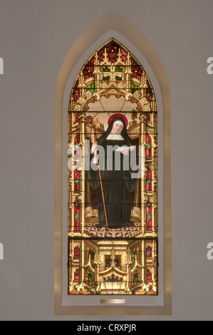 St. Odile (St. Odelia), stained glass window in St. Louis Catholic Church, built 1870, in Castroville, Texas, USA Stock Photo