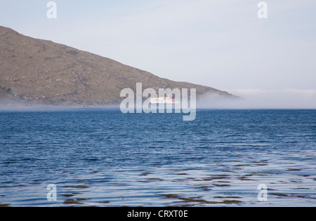 Ullapool Ross and Cromarty Scotland May Calmac ferry from Isle of Lewis on Loch Broom appearing out of the mist important link to Scottish islands Stock Photo