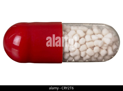 One red pill on a white backgroud Stock Photo