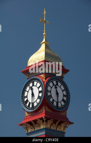 The freshly painted victorian Jubilee clock tower on Weymouth seafront was erected in 1887 to mark fifty years of Queen Victoria’s reign. Dorset, UK. Stock Photo