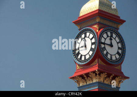 The freshly painted victorian Jubilee clock tower on Weymouth seafront was erected in 1887 to mark fifty years of Queen Victoria’s reign. Dorset, UK. Stock Photo