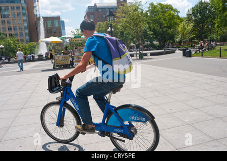 New York, NY - 2 July 2012 Man test riding a CitiBike, part of New York CIty's new BikeShare program to be unveiled this summer. Stock Photo