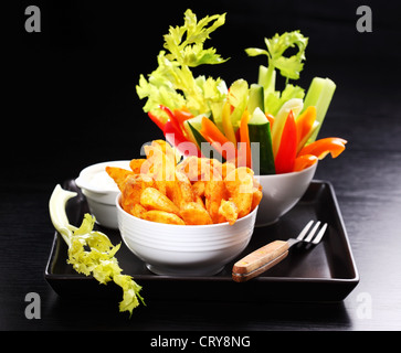 Wedges with raw vegetable and cream cheese dip Stock Photo