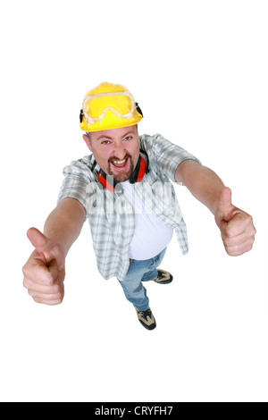 Quirky handyman giving two thumbs-up Stock Photo