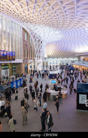 London , Kings Cross Station newly refurbished modernized modernised ticket office area , from balcony above roof feature Stock Photo