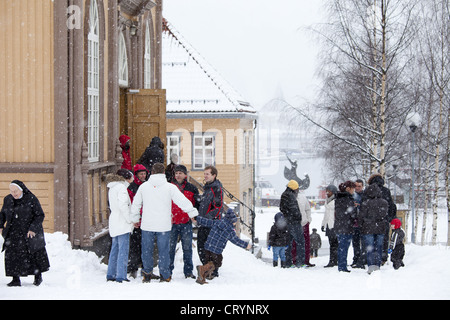 Locals attend Sunday Mass at Catholic Church of Our Lady in Storgata,Tromso within the Arctic Circle in Northern Norway Stock Photo