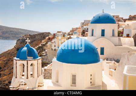 Agios Spiridonas Church in front, and Anastasi Church behind, Oia, Santorini, Greece Stock Photo