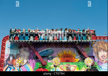 The 'Miami Trip' fairground ride in action Stock Photo