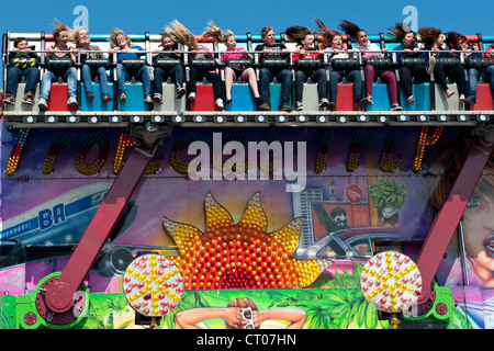 The 'Miami Trip' fairground ride in action Stock Photo