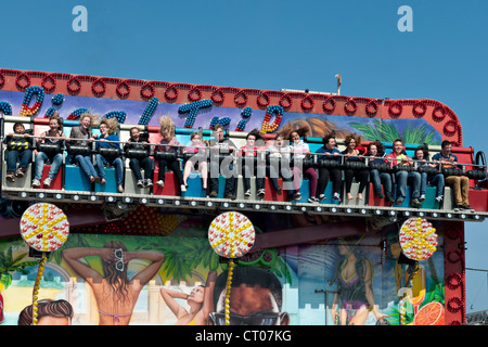 The 'Miami Trip' fairground ride in action Stock Photo