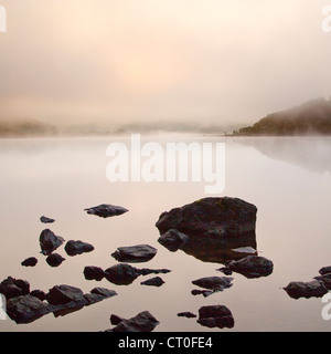 Misty Dawn on Llyn Dinas Lake in the Nantgwynant Valley Snowdonia National Park Gwynedd North Wales UK, Late Spring. Stock Photo