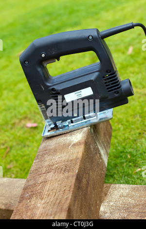 Jigsaw tool cutting a piece of wood on Stock Photo