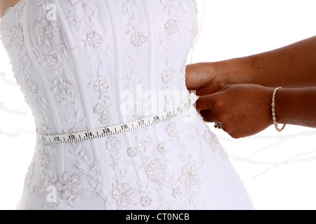 Woman in a wedding dress on white background Stock Photo