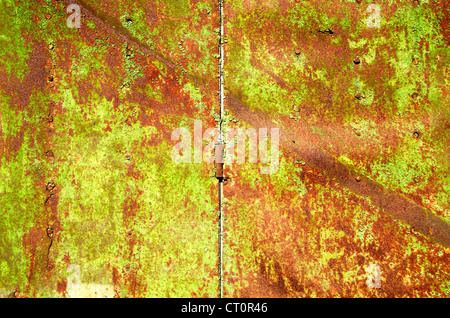 Background of old rusty steel garage door and hinge. Stock Photo