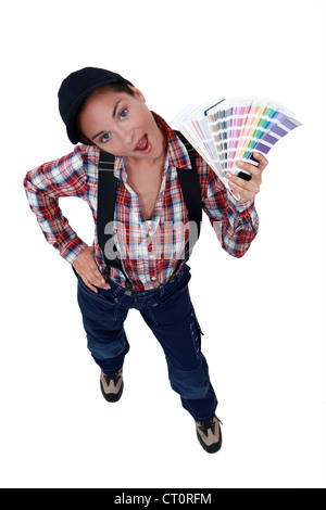 female painter holding a color chart Stock Photo - Alamy