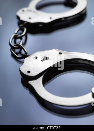 Close up of metal handcuffs Stock Photo
