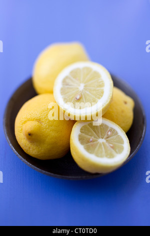 Close up of bowl of lemons Stock Photo