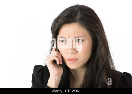 Angry businesswoman talking on phone Stock Photo