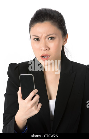Angry businesswoman talking on phone Stock Photo