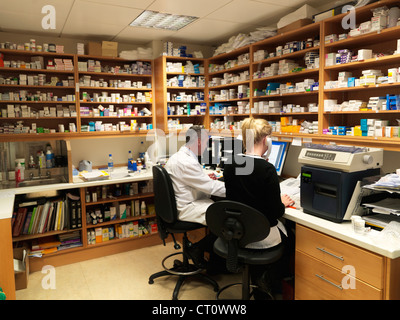 Pharmacists working in office Stock Photo