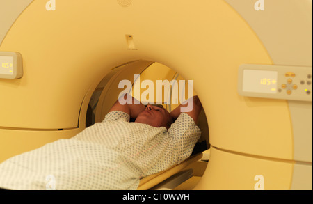 Man relaxing in MRI machine Stock Photo