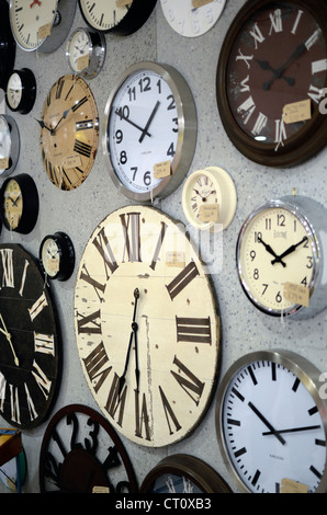 clocks on display in shop windows Stock Photo - Alamy