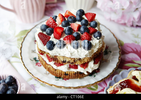 Plate of fruit and cream cake Stock Photo