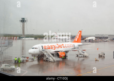 Easy Jet airplane on a rainy day at a UK airport Stock Photo